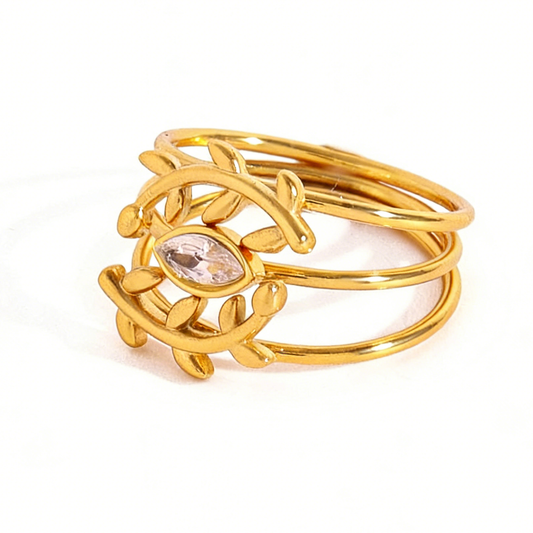 Bague polyvalente en or 18 carats ornée de diamants, d'un motif d'épi de blé et d'un œil protecteur, sertie de trois diamants.